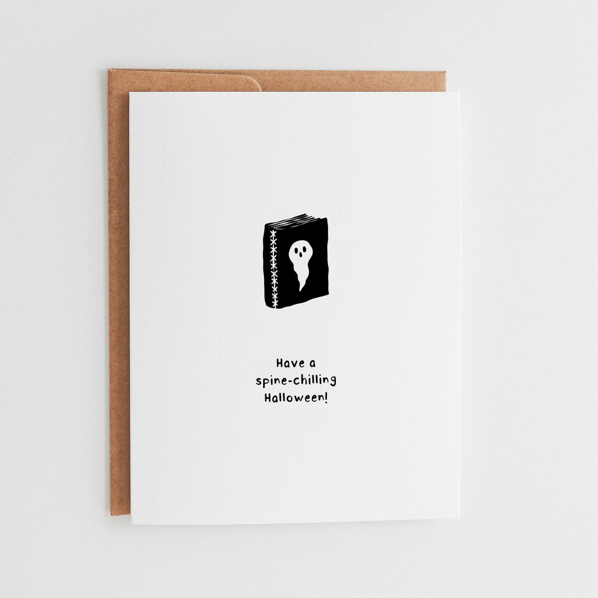 Spine-Chilling Book Lover Halloween Card with ghost book illustration